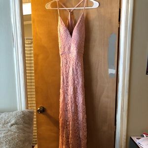 Beautiful dress was one of my prom dresses very pretty has a slit on the side!!